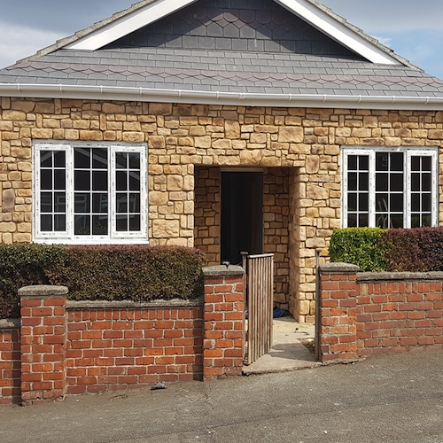 Stone cladding in Cotswold blend on a house exterior, showcasing natural aesthetics and superior design features.