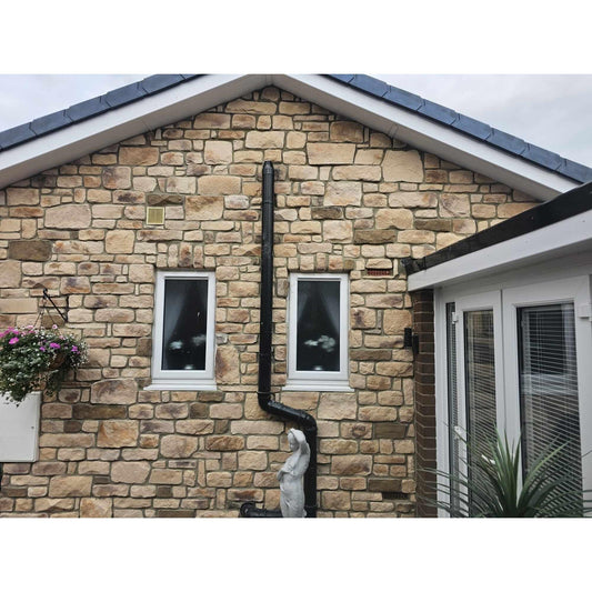Sandstone Blend stone cladding on a residential home exterior with window details