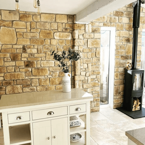 Handmade Cotswold-style stone cladding installed on a feature wall