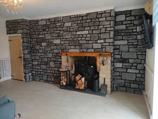 Stone cladding in Midnight Grey enhances this living room with a striking fireplace and stylish decor.