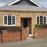 Stone cladding in Cotswold blend on a house exterior, showcasing natural aesthetics and superior design features.