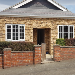 Stone cladding in Cotswold blend on a house exterior, showcasing natural aesthetics and superior design features.