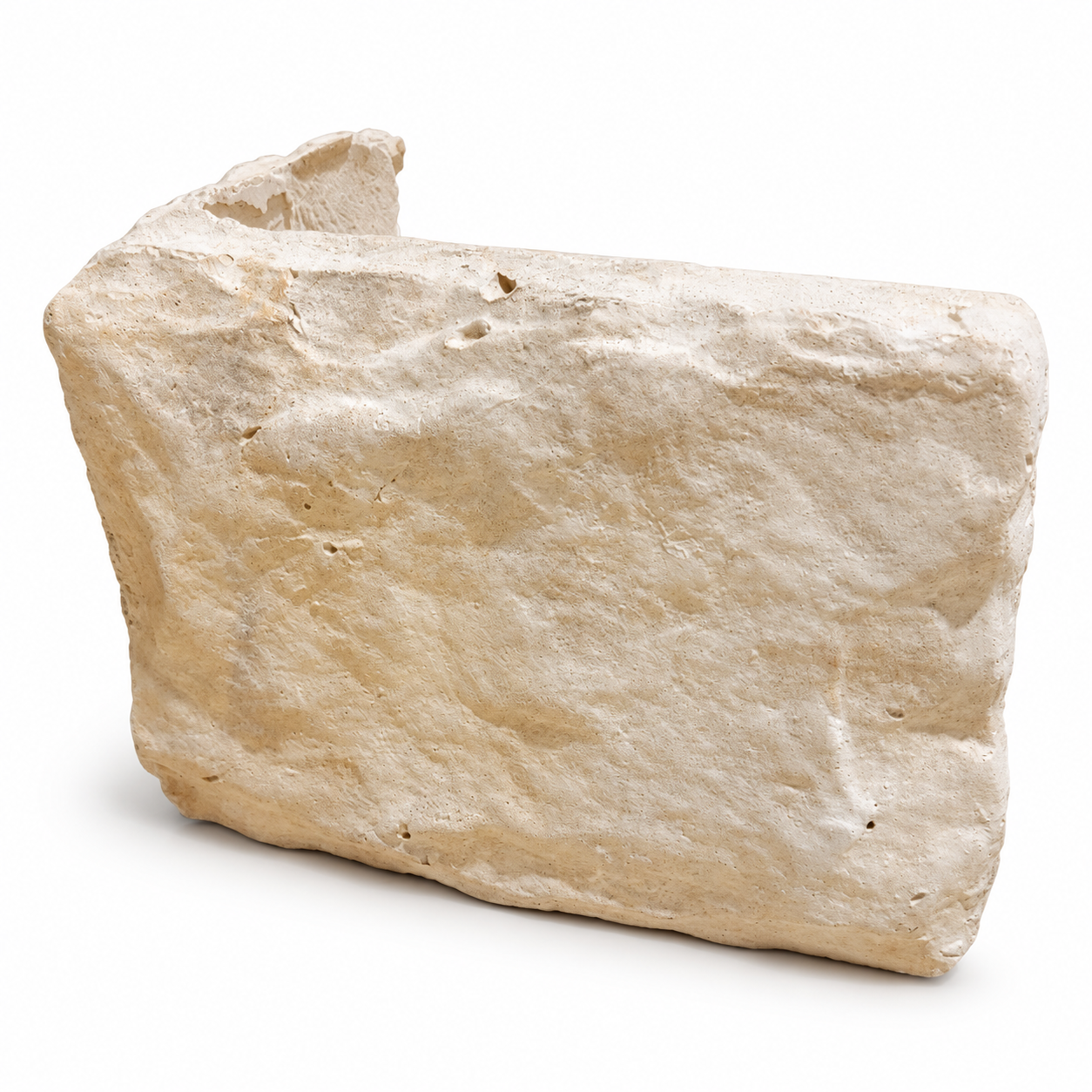 Buff stone cladding corner showing its textured pale buff face and L-shaped return on a white background