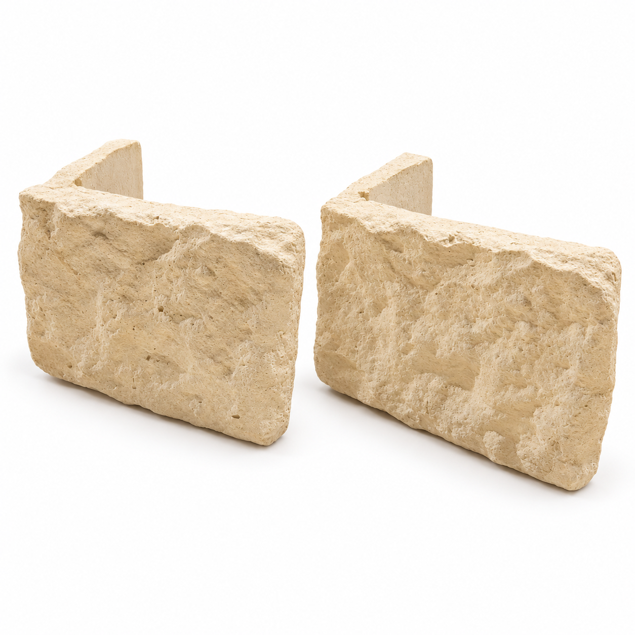 Two Cream Blend stone cladding corners with a consistent cream finish and textured faces on a white background