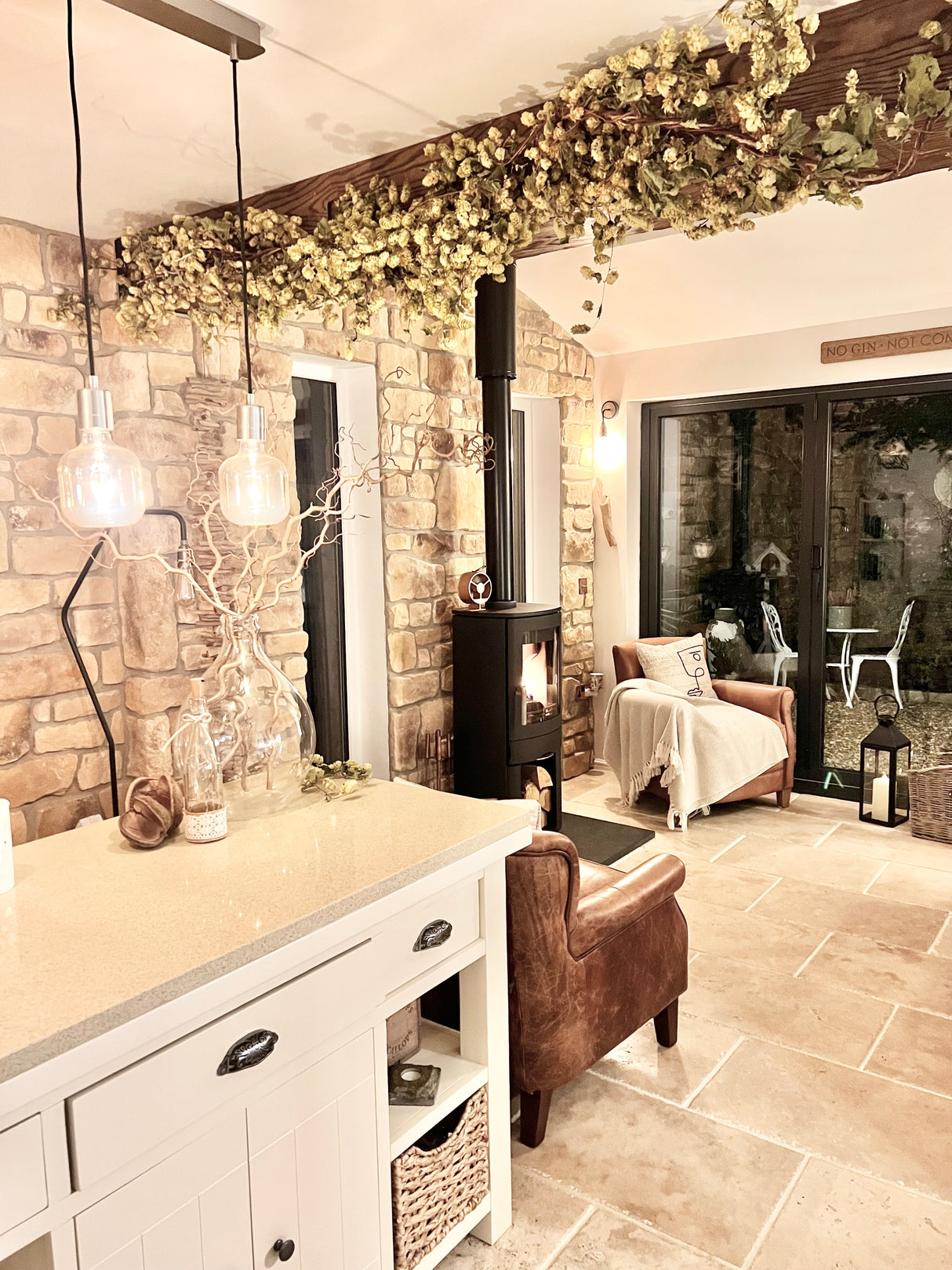 Cozy interior featuring stone cladding walls, a modern fireplace, and stylish lighting accents in a warm living space.