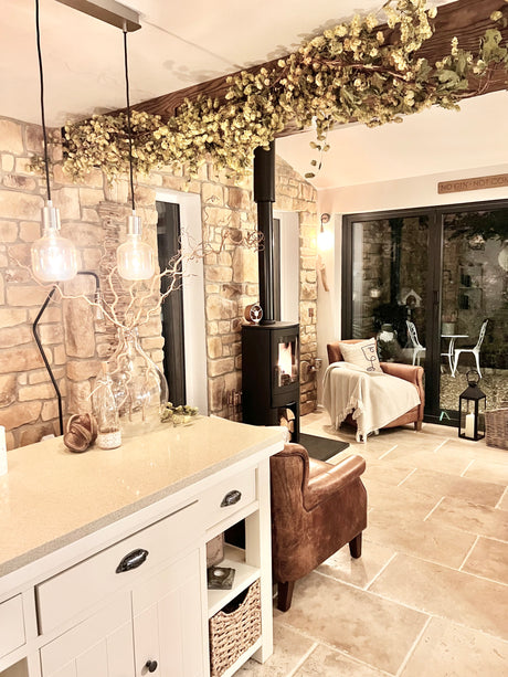 Cozy interior featuring stone cladding walls, a modern fireplace, and stylish lighting accents in a warm living space.