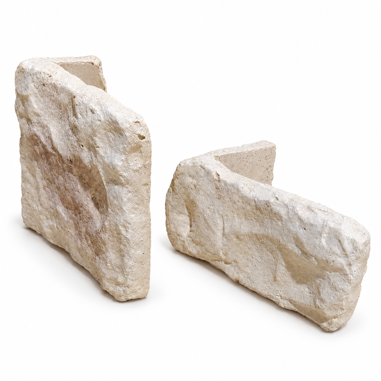 Two Limestone Light Weathered stone cladding corners showing their textured pale buff faces and corner returns on a white background