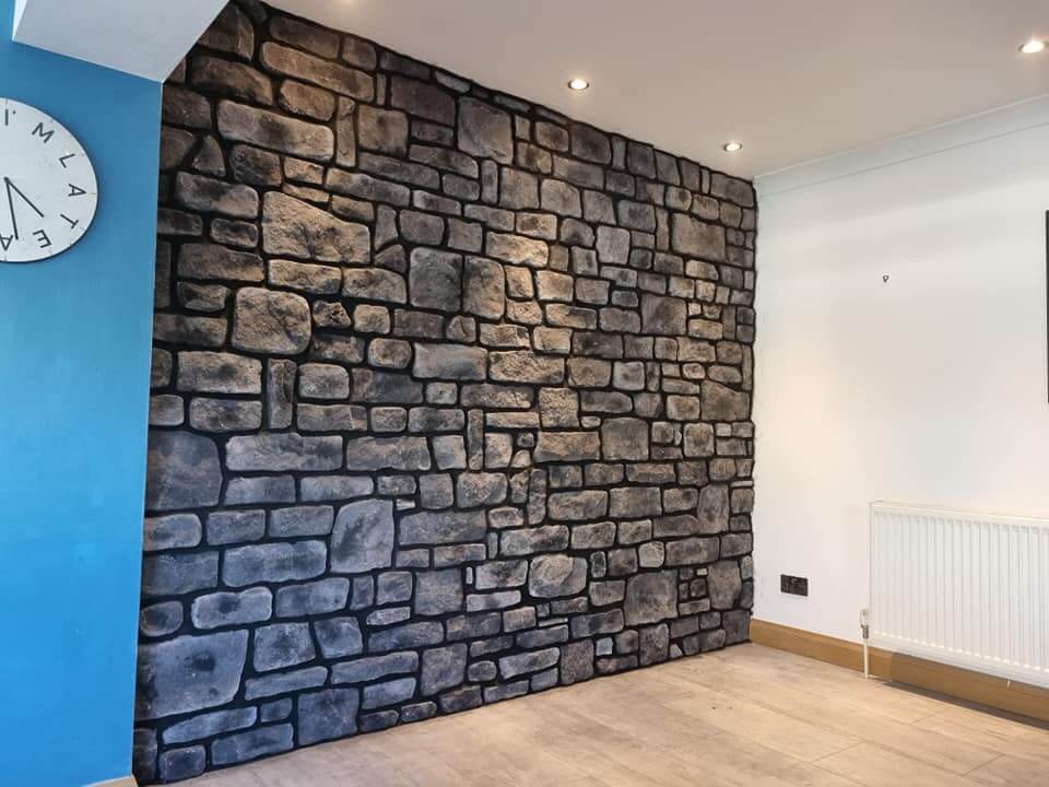 Stone cladding in midnight grey showcased on an interior wall, enhancing the room's natural aesthetics and design.