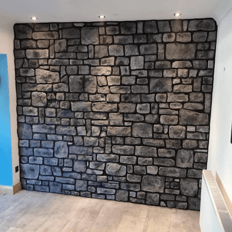 Stylish midnight grey stone cladding wall, showcasing beautiful texture and design in a modern interior setting.