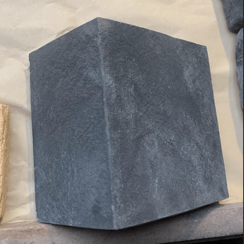 Grey stone cladding quoins showcasing textured finish for home exterior enhancement.